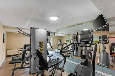 a gym with treadmills and elliptical machines at Quality Inn & Suites in Brampton