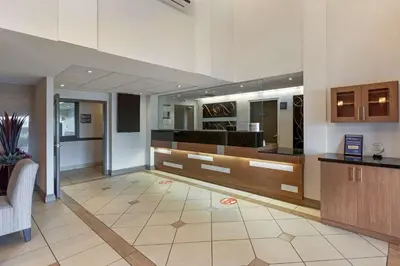a lobby of a hospital with a reception desk at Best Western Plus Burlington Inn & Suites in Burlington