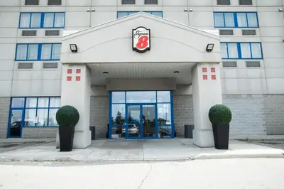 a building with a sign on the front of it at Super 8 by Wyndham Mississauga in Mississauga