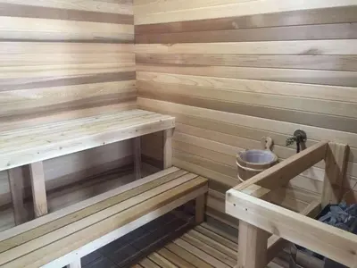 a sauna with wooden walls and wooden benches at Park Inn by Radisson Toronto-Markham in Markham