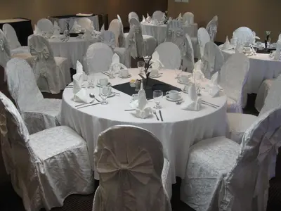 a group of tables and chairs with white table cloths at Park Inn by Radisson Toronto-Markham in Markham