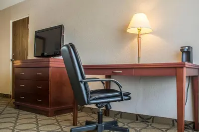 a desk with a chair and a television in a hotel room at Comfort Inn in London