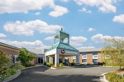 a building with a clock tower on top of it at Best Western Plus Stoneridge Inn & Conference Centre London Ontario in London