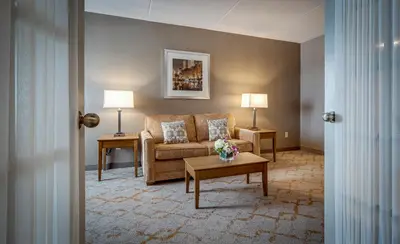 a living room with a couch and a table at Monte Carlo Inn Vaughan Suites in Vaughan