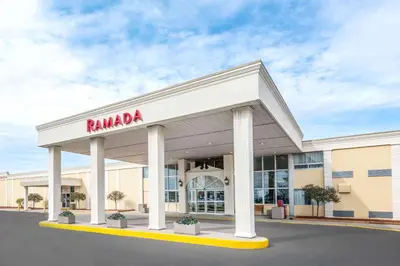 a ramara building with a sign on the front at Ramada by Wyndham London in London