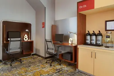an office with two chairs and a desk with a computer at TownePlace Suites by Marriott London in London