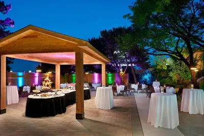 a pavilion with tables and chairs at night at Four Points by Sheraton Toronto Airport in Mississauga