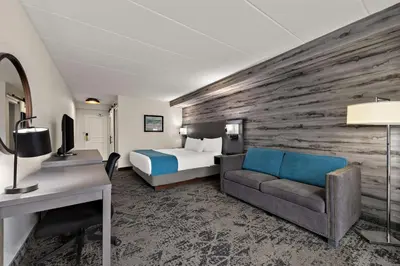a hotel room with a bed and a desk at Best Western Parkway Hotel Toronto North in Richmond Hill