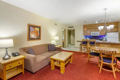 a living room with a couch and a kitchen at Carriage Ridge Resort, an Ascend Collection Resort in Oro-Medonte