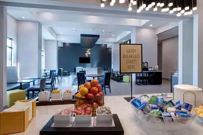 a lobby with a buffet of food on a table at Hampton Inn & Suites Burlington, Ontario, Canada in Burlington