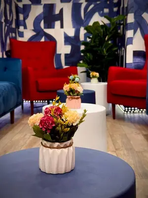 a room with two vases with flowers on a table at Royal Oak Inn in Toronto