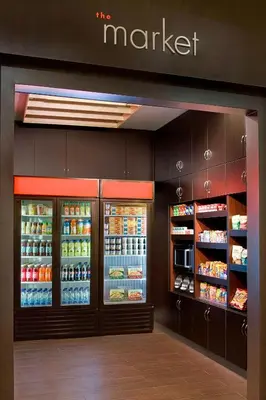a market store with its refrigerators and food at Courtyard by Marriott Toronto Brampton in Brampton