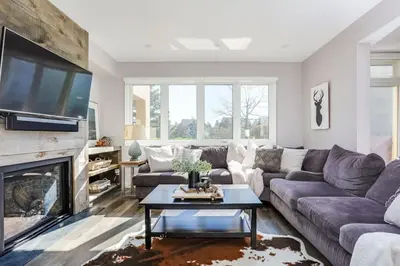 a living room with a couch and a fireplace at Wintergreen Haven 85574 in Blue Mountains