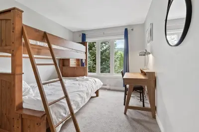 a bedroom with a bunk bed and a desk at All Seasons Sierra Lane Retreat 88371 in Blue Mountains