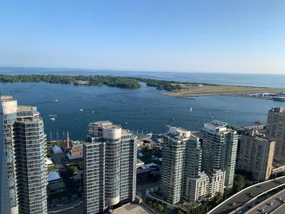 an aerial view of a city with a body of water at Magnificient View next CN Tower/Rogers/Union/MTCC in Toronto