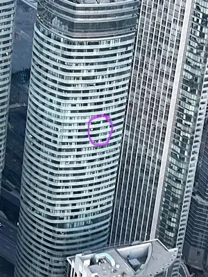 a building with a purple symbol on the side of it at Magnificient View next CN Tower/Rogers/Union/MTCC in Toronto