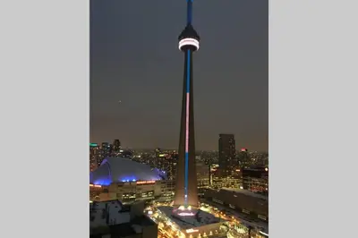 a view of the cn tower lit up at night at Magnificient View next CN Tower/Rogers/Union/MTCC in Toronto