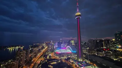 a view of a city at night with the cn tower at Magnificient View next CN Tower/Rogers/Union/MTCC in Toronto