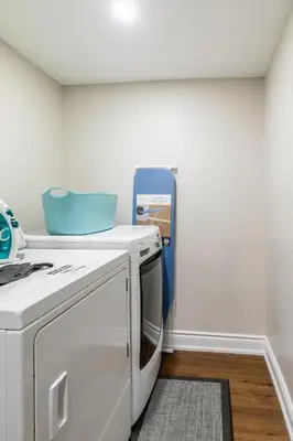 a kitchen with a stove and a white microwave at Spacious basement in Mississauga