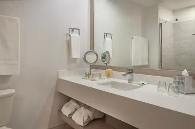 a white bathroom with a sink and a mirror at White Oaks Conference & Resort Spa in Niagara on the Lake