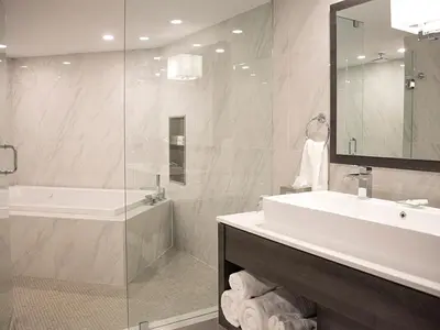 a bathroom with a sink and a shower and a tub at White Oaks Conference & Resort Spa in Niagara on the Lake