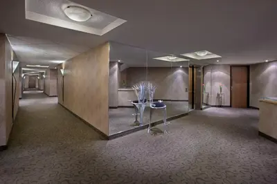 a room with a hallway with a table in it at White Oaks Conference & Resort Spa in Niagara on the Lake