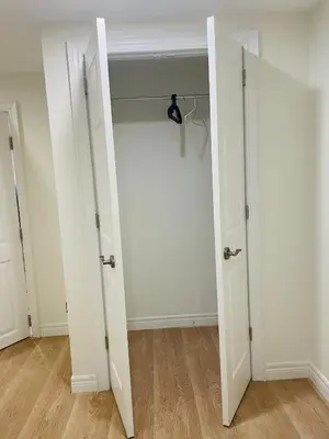 an empty room with two doors and a closet at MT house in Mississauga