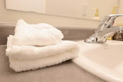a white toothbrush sitting on top of a sink at Luxurious Condo Apartment 2BRs-1BAs-1Office with free parking in Brampton