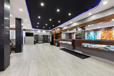 a lobby of a building with a reception desk at Best Western Plus Toronto North York Hotel & Suites in Toronto
