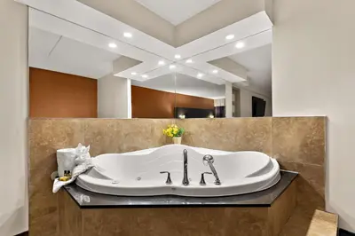 a bath tub sitting on a counter in a bathroom at Best Western Plus Toronto North York Hotel & Suites in Toronto