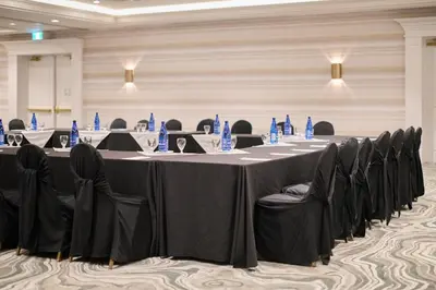 a group of tables and chairs in a room at Holiday Inn Hotel & Suites St.Catharines-Niagara by IHG in St. Catharines