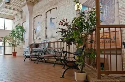 a group of benches in a room with a brick wall at Ranch House Inn in Exeter