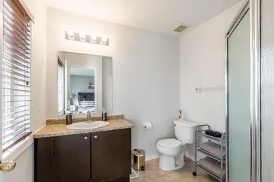 a bathroom with a sink and a toilet at GlobalStay 3 Bedroom Townhome with Hot Tub Hamilton in Hamilton