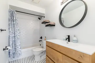 a bathroom with a sink and a mirror at GlobalStay 3 Bedroom Townhome with Hot Tub Hamilton in Hamilton