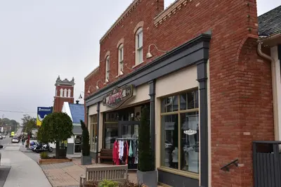 a brick building with a clothing store on a street at Hammer Haus III in Waterloo