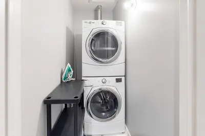 two washing machines and a washer and dryer in a room at Wintergreen 119 in Blue Mountains