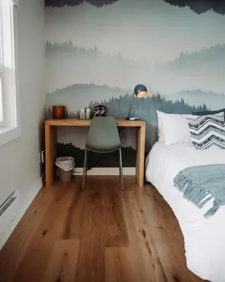 a bedroom with a bed and a desk with a chair at Penny's Motel in Thornbury
