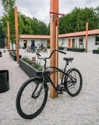 a bike parked next to a wooden pole at Penny's Motel in Thornbury