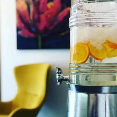 a glass jar with an orange slice in it at Willowdale Hotel Toronto North York in Toronto