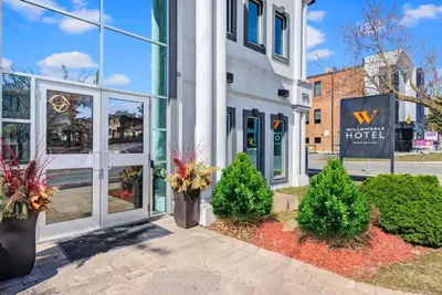 a view of the front of a building with a hotel at Willowdale Hotel Toronto North York in Toronto