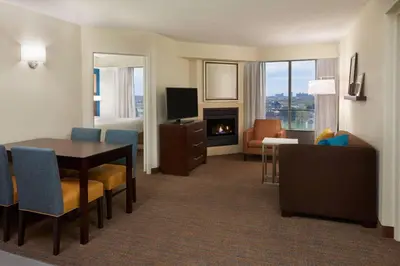 a hotel room with a dining table and a living room at Residence Inn by Marriott Toronto Airport in Toronto
