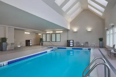 a large swimming pool in a hotel room with at Residence Inn by Marriott Toronto Airport in Toronto