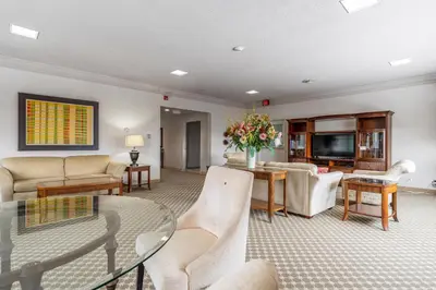 a living room filled with furniture and a tv at Guest House on the Mount in London
