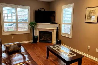 a living room with a couch and a fireplace at Aurora Executive Upscale Residence Three Bedrooms Three and Half Bathrooms in Aurora