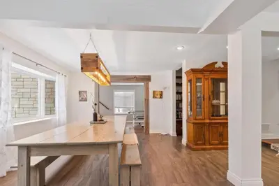 a dining room with a wooden table in a room at Paradise Manor w Hot tub Sauna & Putting Green in Blue Mountains