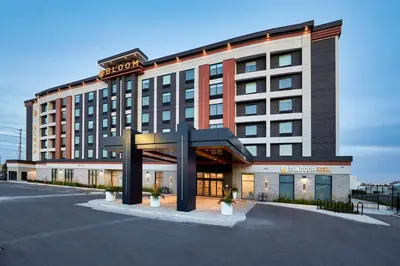 a hotel building with a sign on top of it at Bloom Mississauga, Tapestry Collection By Hilton in Mississauga