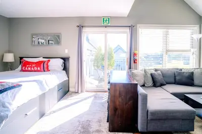 a living room with a bed and a couch at Hillside BLUE MTN Family Loft @ North Creek Resort in Blue Mountains