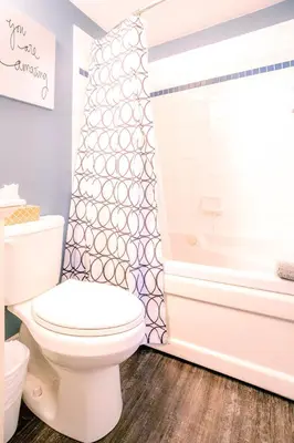 a bathroom with a white toilet and a tub at Updated Blue Mountain Studio @ North Creek Resort in Blue Mountains