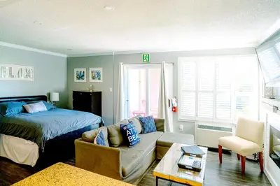 a living room with a bed and a couch at Updated Blue Mountain Studio @ North Creek Resort in Blue Mountains