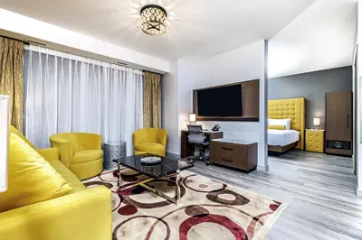 a hotel room with a couch and a bed at Hyatt Place Toronto-Brampton in Brampton